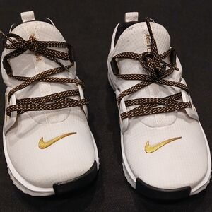 Nike Kids White Sneakers with Gold Accents